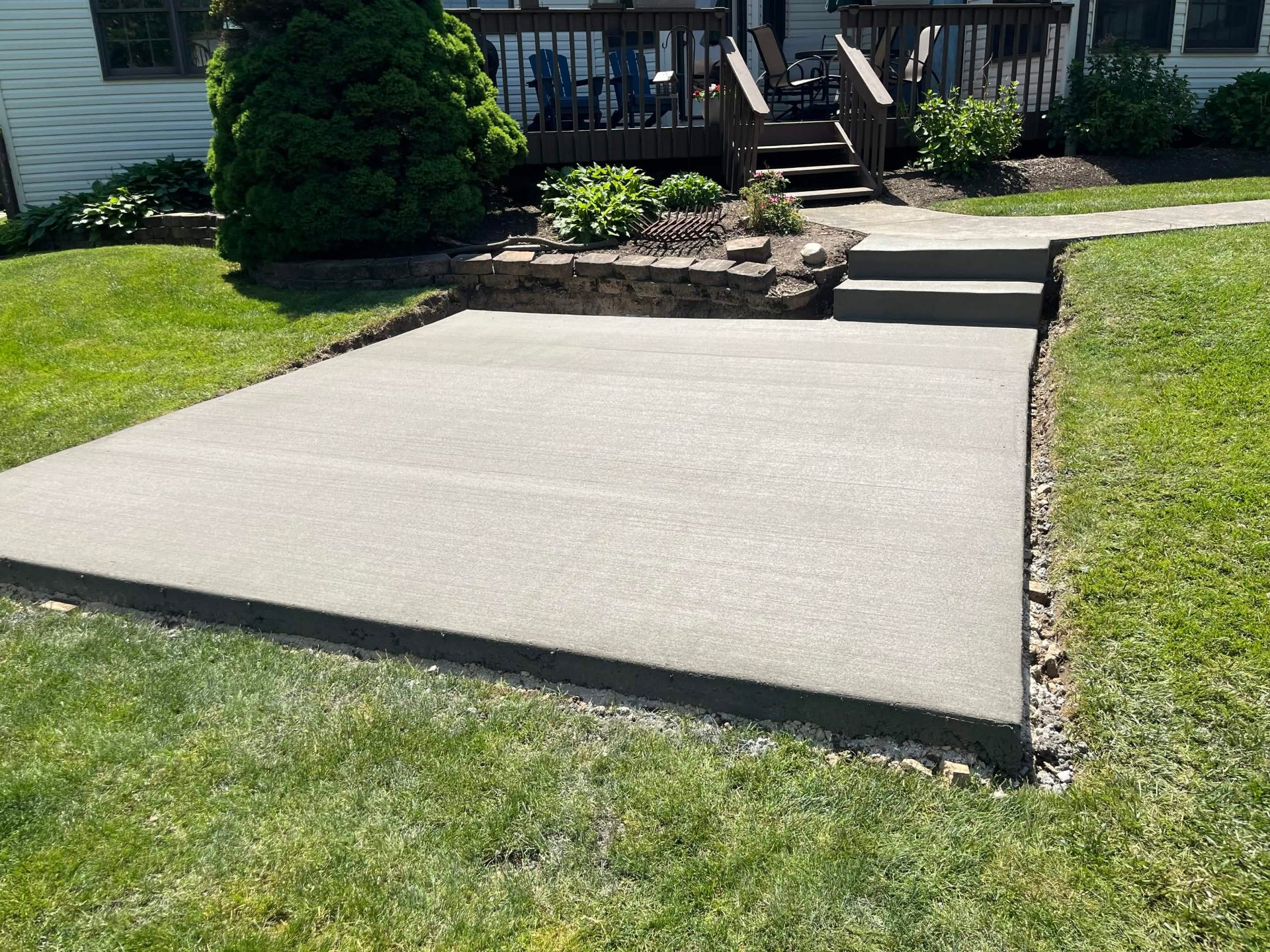 Backyard concrete slab patio